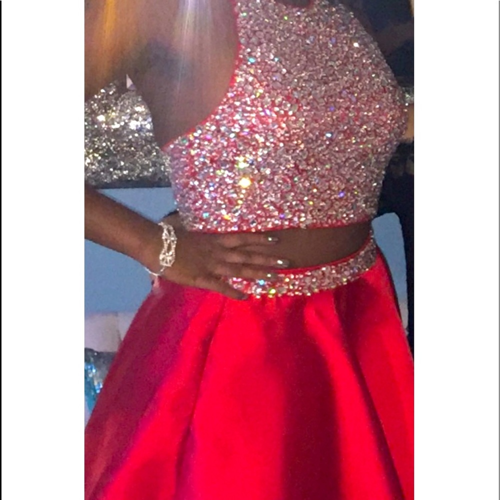 Red 2 piece evening gown. Halter top with sequin and beads. Beaded skirt.
